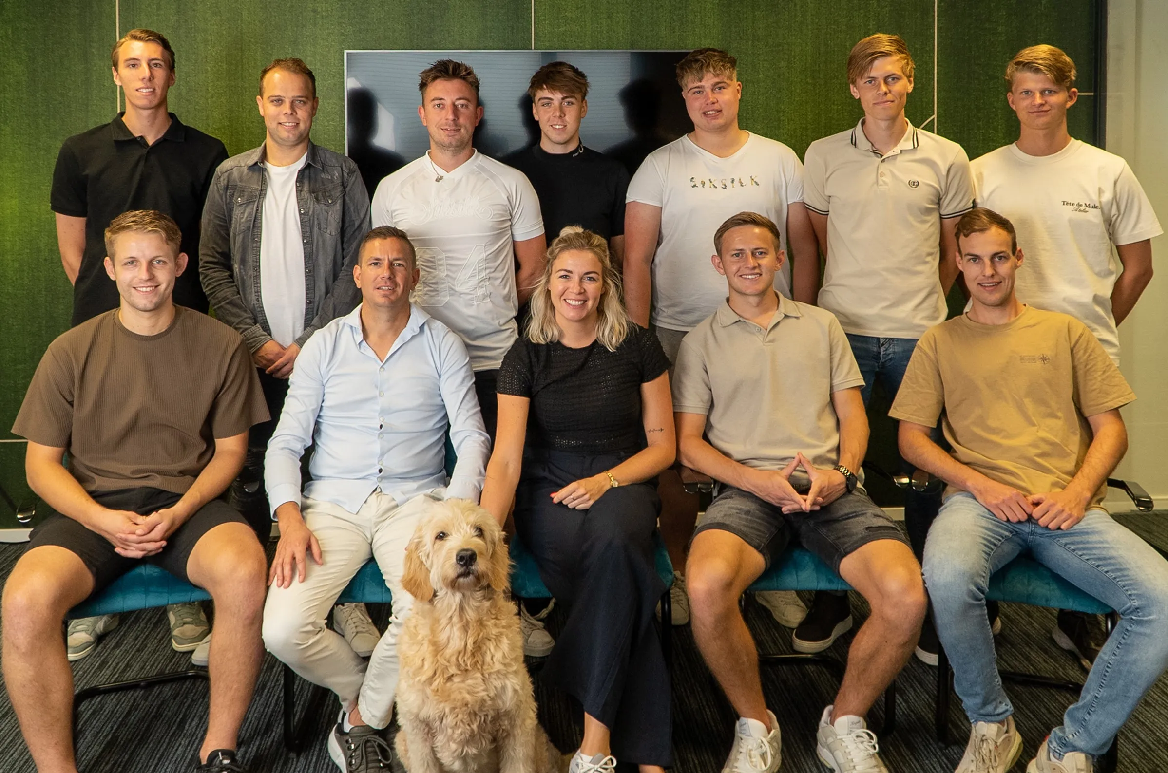 The Volendam team together in the office, with Daley the office dog